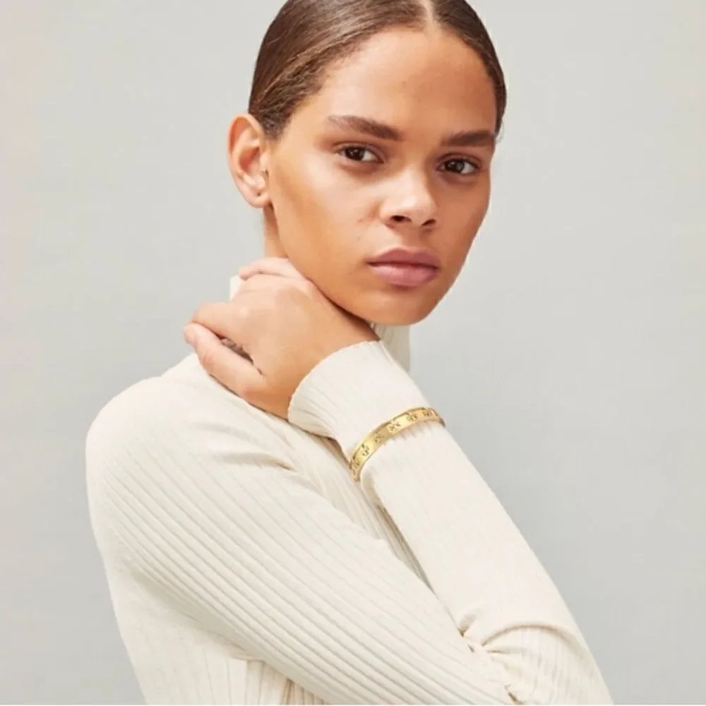 TORY BURCH RAISE LOGO STUDDED 18k GOLD PLATED BRACELET